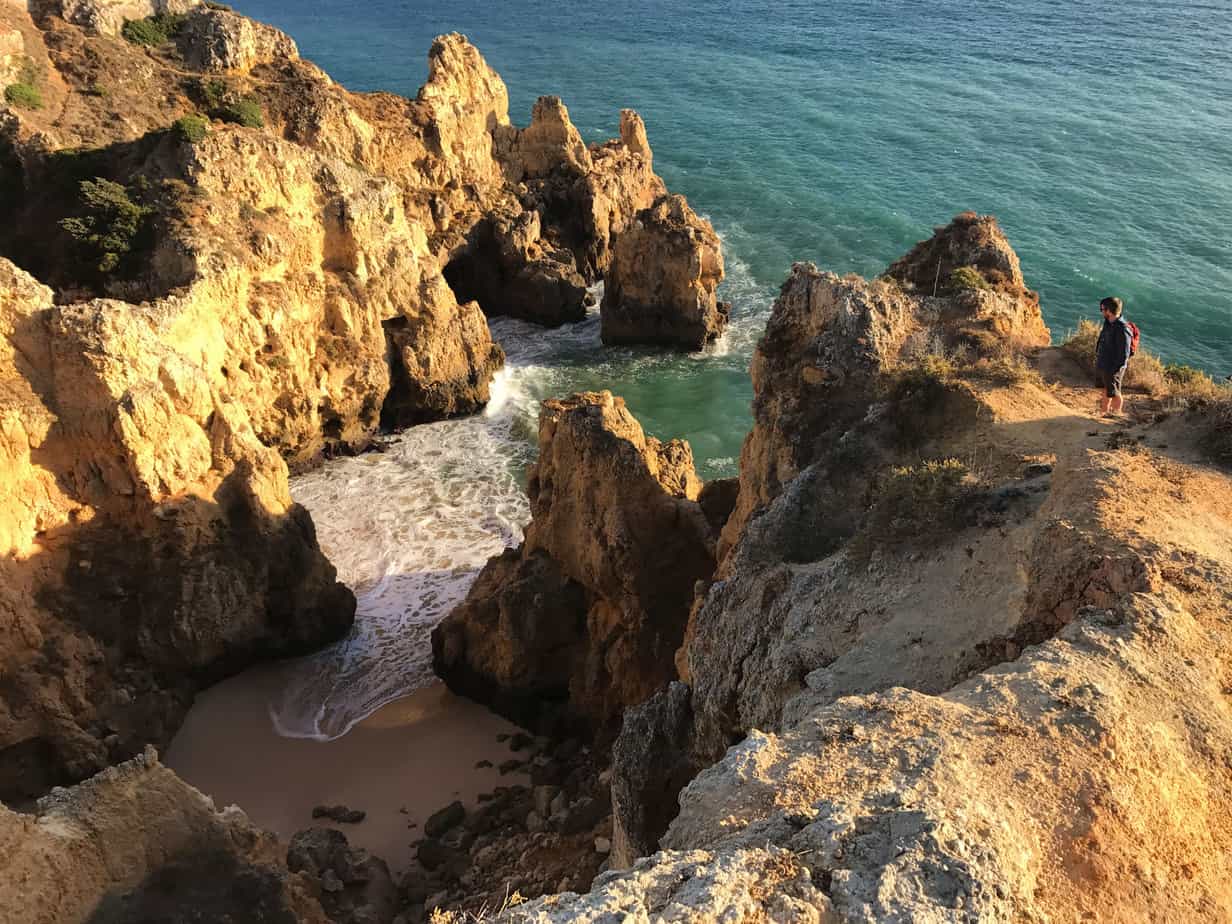 sandstone cliffs surrounding a beach