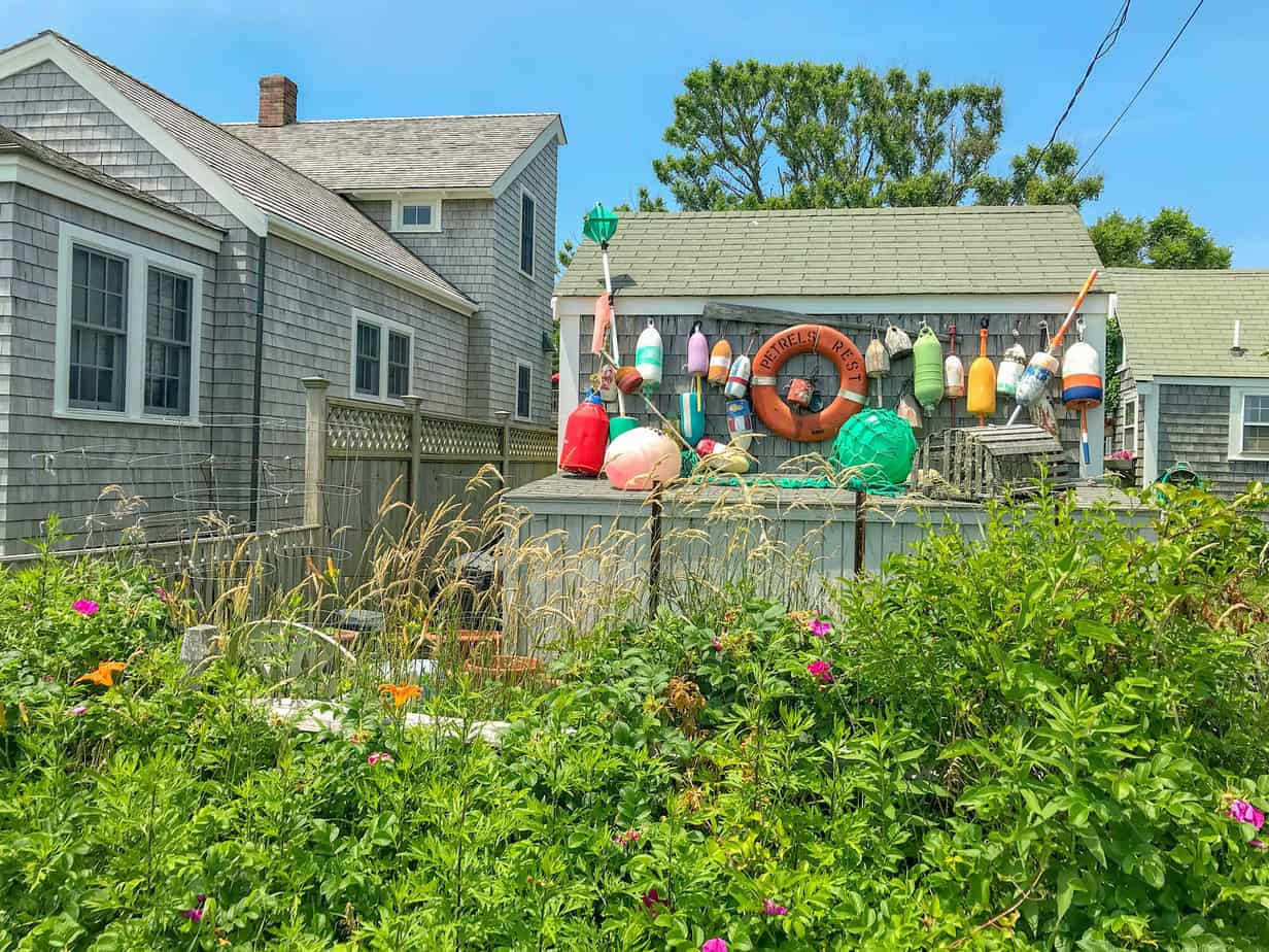 shingle house decorated with colorful bouys