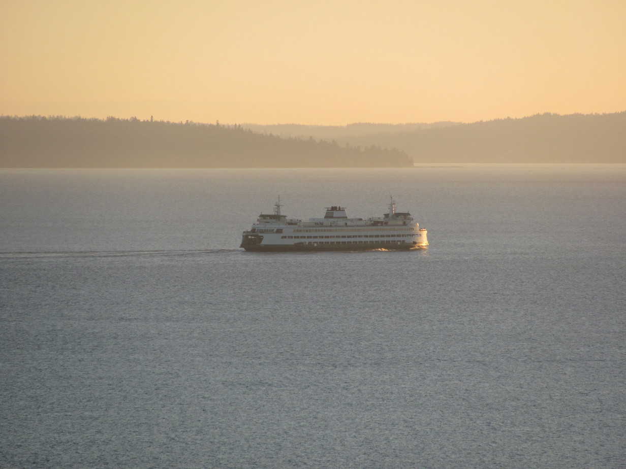 ferry sailing across Puget Sound at sunset